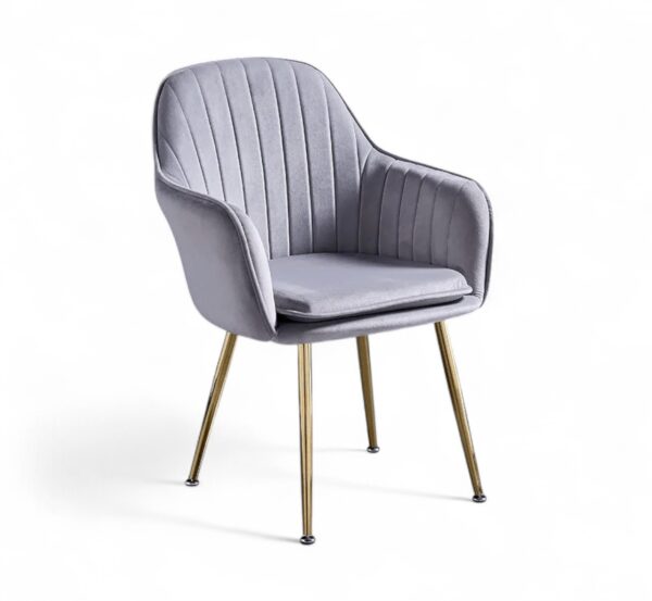 Modern velvet armchair with slim gold legs and scalloped back