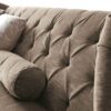 Luxurious winged sofa with elegant tufted upholstery in neutral tones
