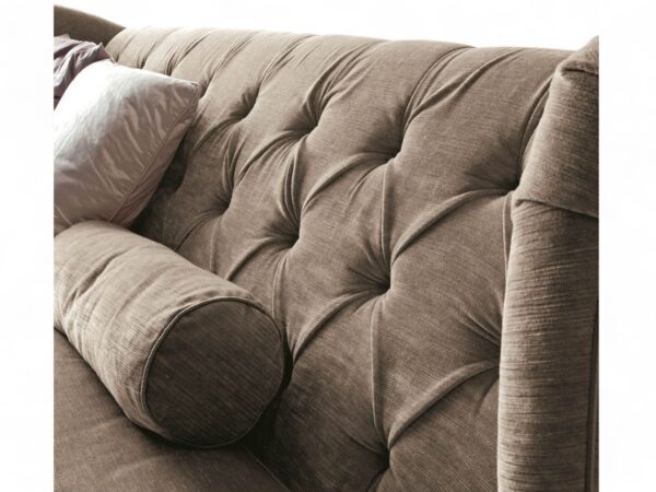 Luxurious winged sofa with elegant tufted upholstery in neutral tones