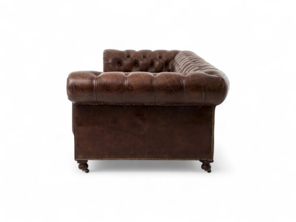 Vintage-style leather sofa with rolled arms