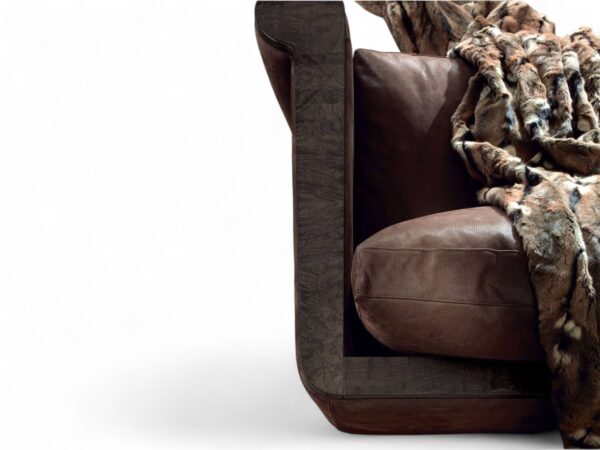 Luxurious brown leather sofa featuring sleek design and unique armrests