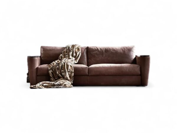 Modern three-seater sofa in brown leather with plush cushions
