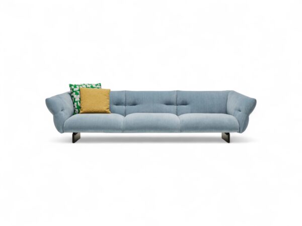 Stylish modern sofa with light blue upholstery and throw pillows
