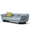Stylish modern sofa with light blue upholstery and throw pillows