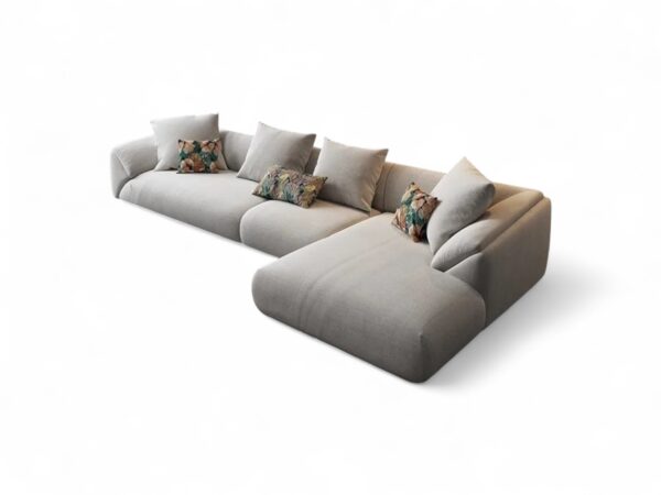 Designer sofa with luxury neutral fabric and cozy pillows