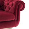 Elegant Chesterfield sofa with deep tufting and velvet upholstery