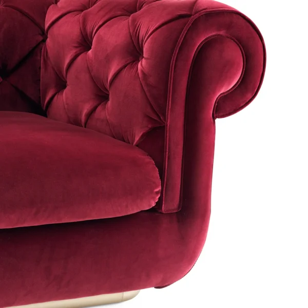 Elegant Chesterfield sofa with deep tufting and velvet upholstery