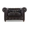 Leather Chesterfield armchair with buttoned backrest and nailhead trim