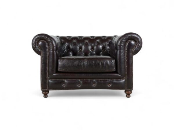 Leather Chesterfield armchair with buttoned backrest and nailhead trim