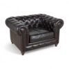 Classic Chesterfield chair in dark leather with elegant detailing