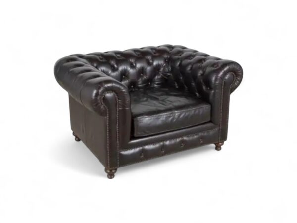 Classic Chesterfield chair in dark leather with elegant detailing