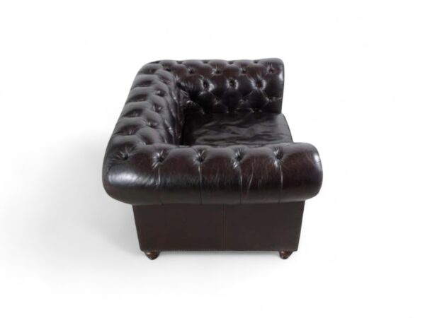 Traditional leather armchair with premium upholstery and wooden legs