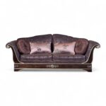 Art Deco Style Sofa with intricate floral upholstery and metallic accents