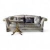 Luxurious vintage-inspired sofa featuring velvet fabric and sculptural frame