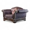 Elegant Art Deco sofa with decorative pillows and golden detailing