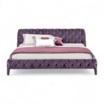 Velvet Twilight Bed with deep tufted violet velvet upholstery.