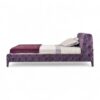 Luxury upholstered bed with plush violet velvet and elegant curves.