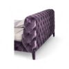 Contemporary violet bed with soft velvet and cushioned frame.