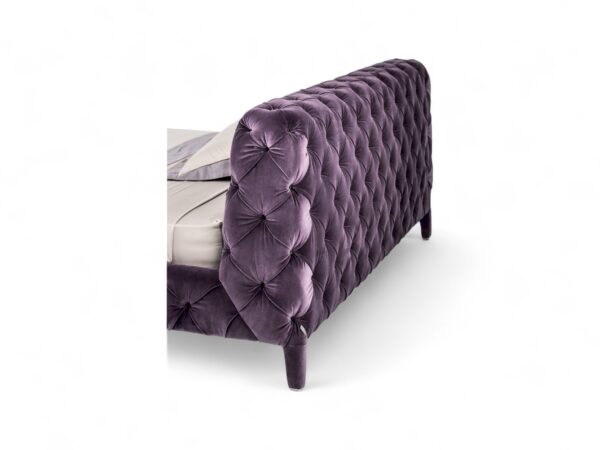 Contemporary violet bed with soft velvet and cushioned frame.