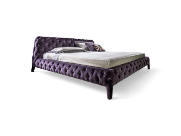 Statement bed in rich velvet with fully tufted headboard and base.