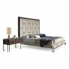 Luxe bed with tall geometric headboard for modern interiors