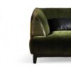 Luxury curved sofa in emerald green velvet upholstery