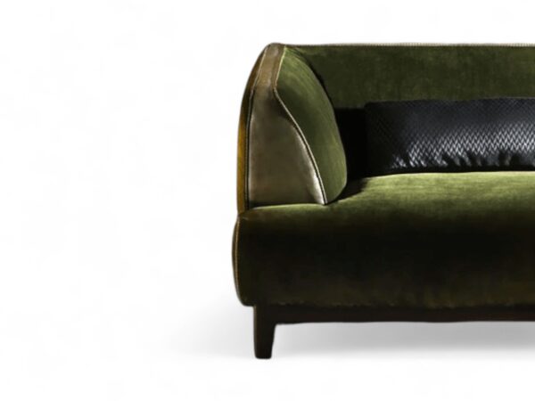 Luxury curved sofa in emerald green velvet upholstery