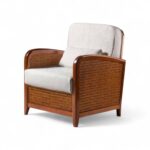 Riviera Cane Armchair with wooden frame and neutral cushions