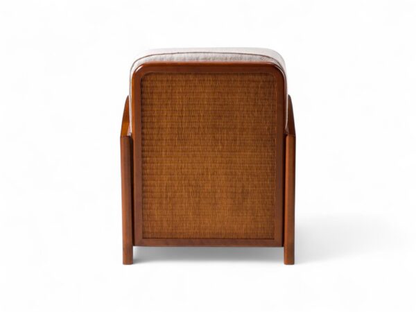 Wooden armchair with cane panels and padded cushions
