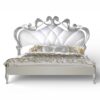 Pearl and Silver Carved Bed with tufted pearl upholstery and sculpted frame
