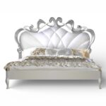 Pearl and Silver Carved Bed with tufted pearl upholstery and sculpted frame