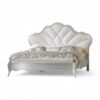 Luxury ivory bed frame with gold accents and soft upholstery
