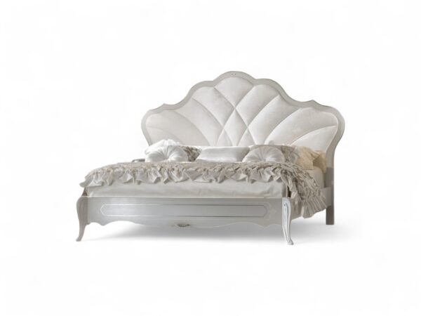 Luxury ivory bed frame with gold accents and soft upholstery