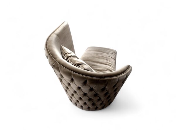 Modern curved sofa with tufted back design and plush cushioning for luxury interiors
