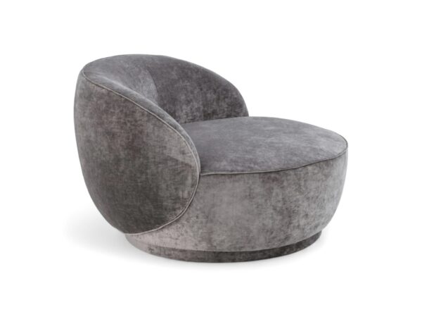 Blush pink velvet swivel chair with circular design