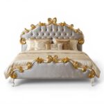 Carved Gold Leaf Bed with intricate gold detailing on the headboard and footboard