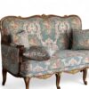 Elegant French Rococo three-seater sofa with gilded wood detailing