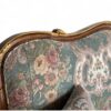 Hand-carved Louis XV style sofa with cabriole legs and floral fabric