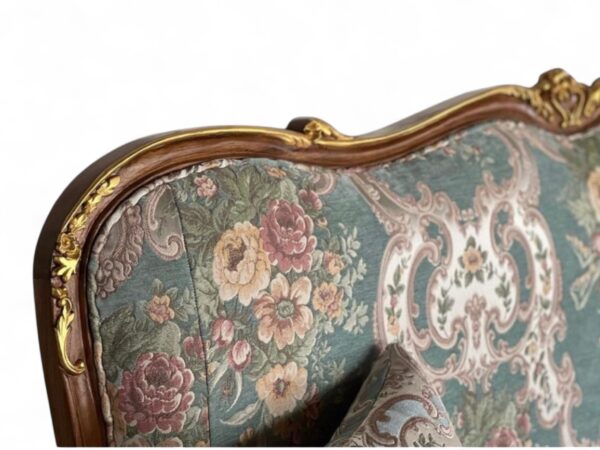Hand-carved Louis XV style sofa with cabriole legs and floral fabric
