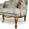Antique-style Louis XV carved sofa with plush cushions and ornate frame