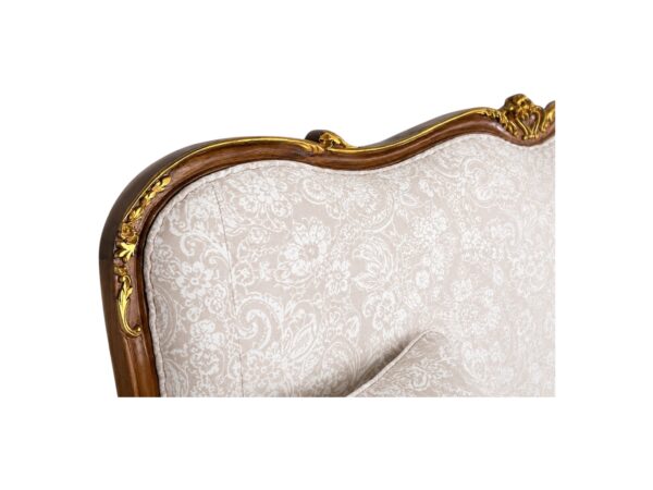 Hand-carved Louis XV style sofa with cabriole legs and floral fabric