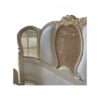 Vintage-inspired bed with French carving details and neutral upholstery