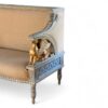 Luxury carved sofa with griffin sculptures and detailed accents