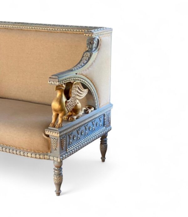 Luxury carved sofa with griffin sculptures and detailed accents