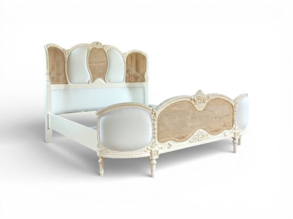 Vintage wooden bed with carved details and cane panel sides