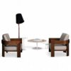 Modern armchair with a sculptural wooden frame and cozy cushion