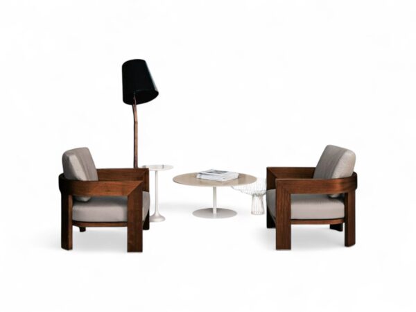 Modern armchair with a sculptural wooden frame and cozy cushion