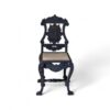 Noir Crest Chair with arched cane back and carved black frame