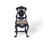 Noir Crest Chair with arched cane back and carved black frame