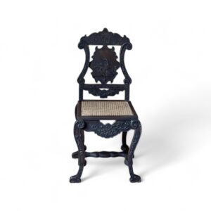 Noir Crest Chair with arched cane back and carved black frame
